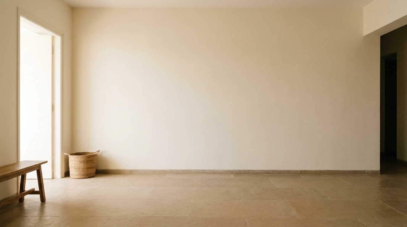 Plain bare entryway wall in an Indian apartment before moulding.