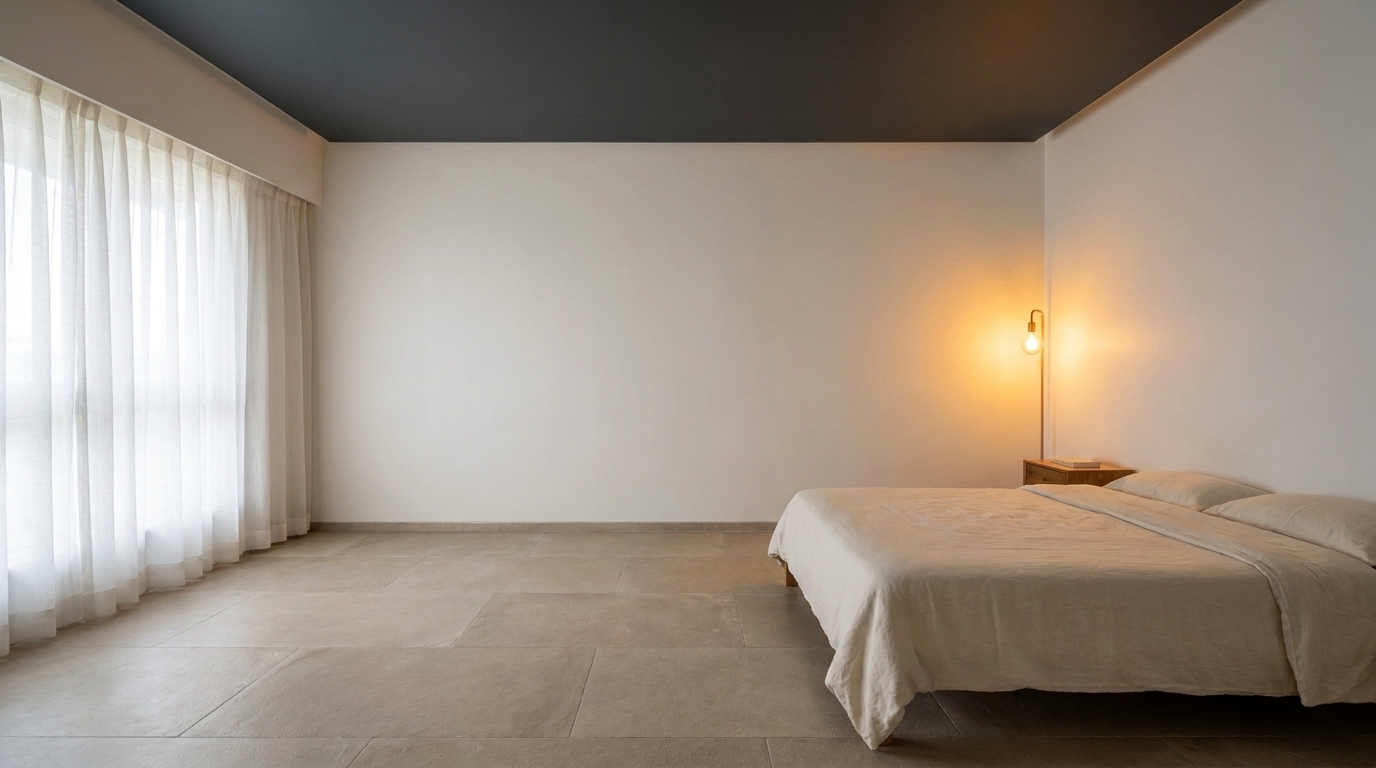 Bedroom with dark ceiling and lighter walls creating a cozy, enclosed feeling.
