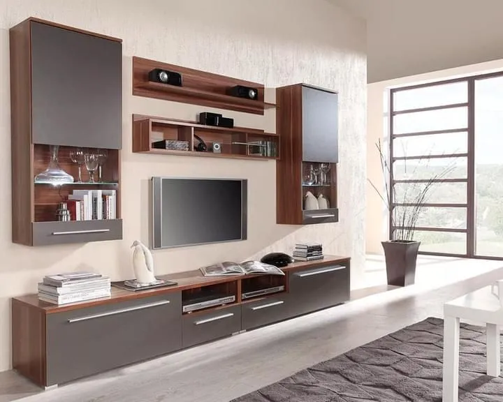 Render of a living room wall system in walnut and grey gloss - two lit glass display cabinets hung either side of the TV