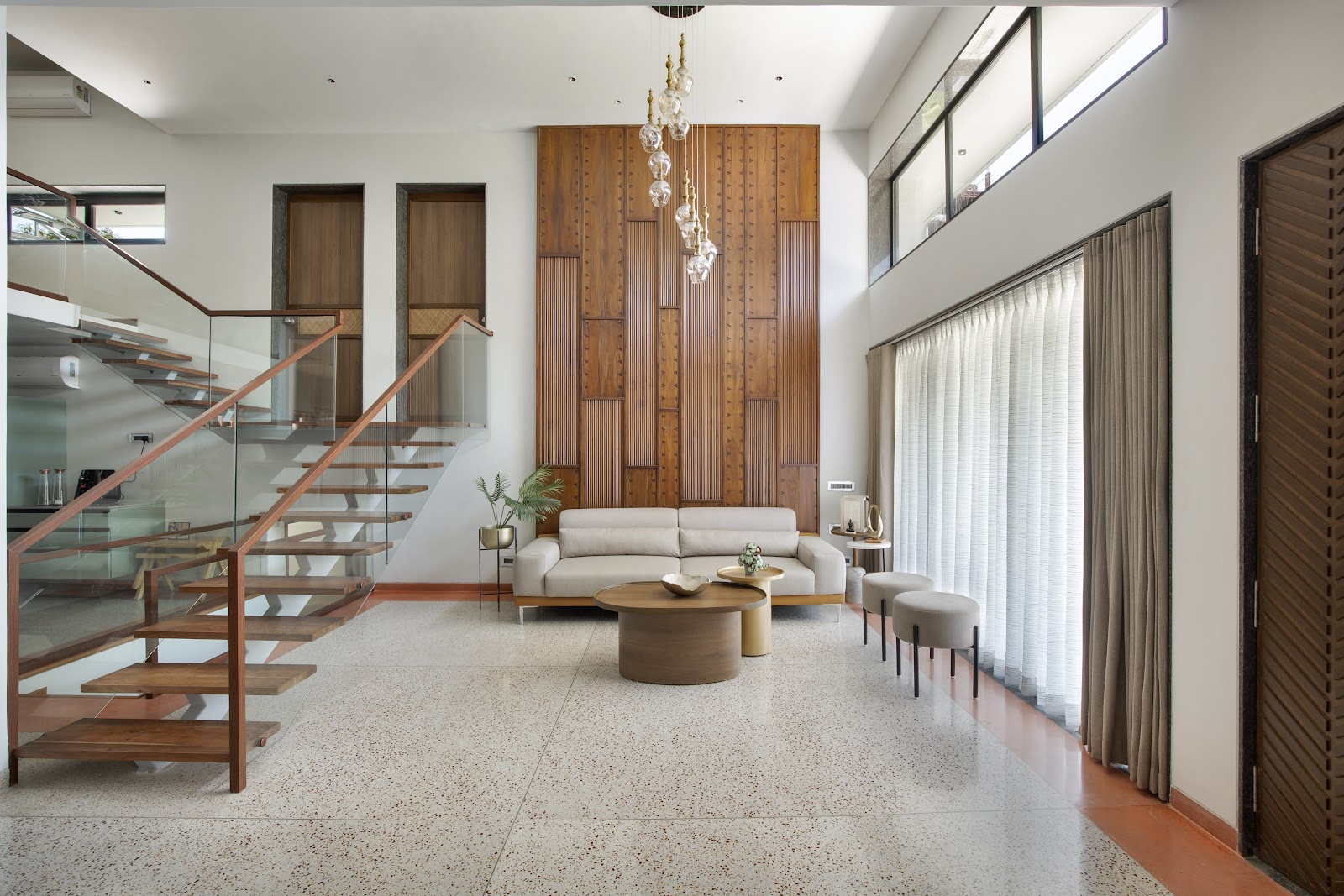 beige modern indian living room with panelling — real Indian home