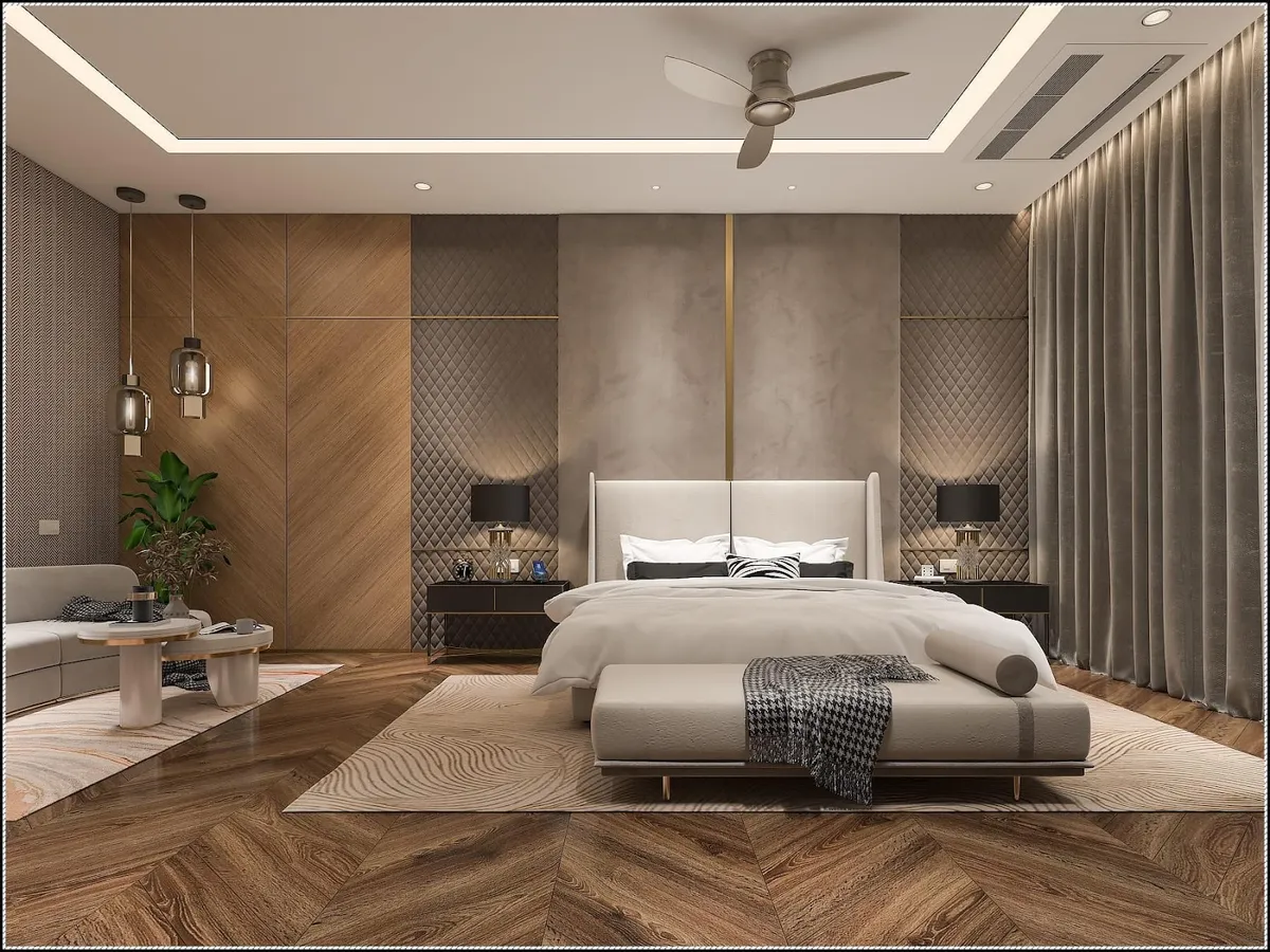 Render of a luxury master bedroom with a wood-panelled wardrobe wall, quilted panels flanking a marble and brass headboard wall, herringbone wood flooring