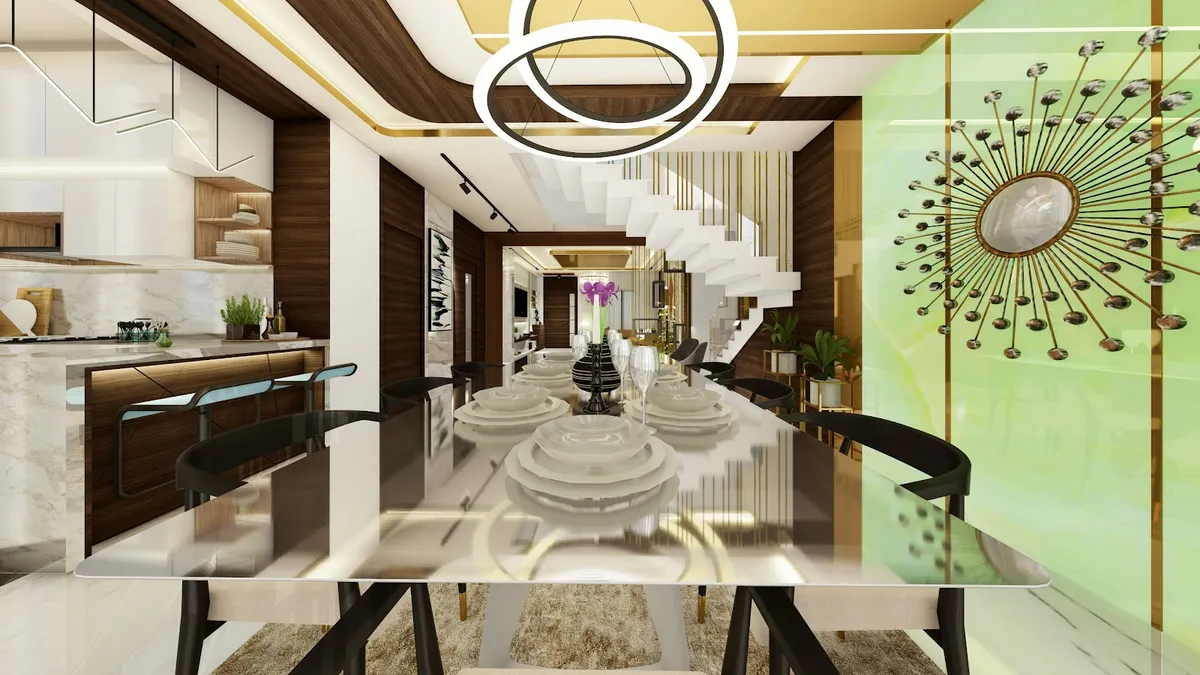 Render looking down a long white-stone dining table set with stacked plates and glassware, twin ring pendants overhead