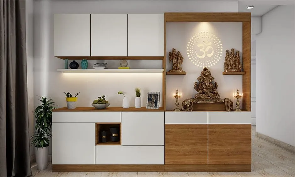 Render of a combined pooja and sideboard run: teak-framed mandir niche with a backlit Om sunburst jaali behind a seated Ganesh on a floating platform and brass