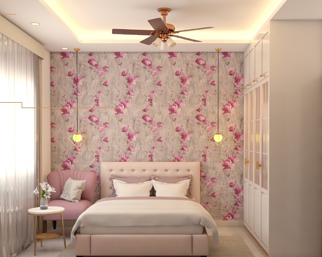 Render of a bedroom with a pink floral wallpaper accent wall, a blush tufted upholstered bed, a matching pink armchair