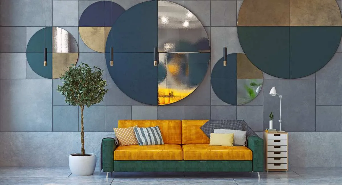 Render of a living room with a mustard and green velvet sofa beneath a cluster of oversized circular mirror and panel wall art in teal, brass and grey.