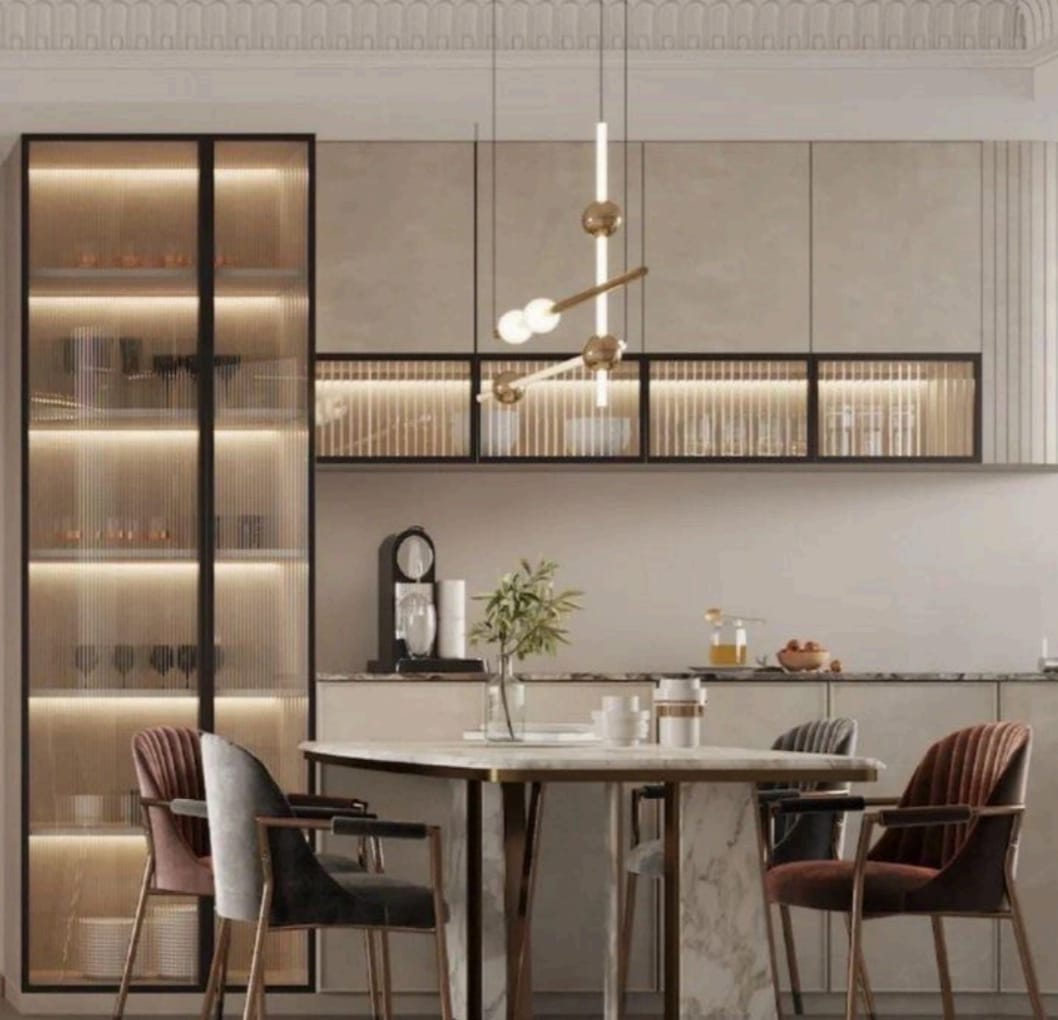 Rendered kitchen-dining space with a marble waterfall-edge round dining table, mixed velvet chairs