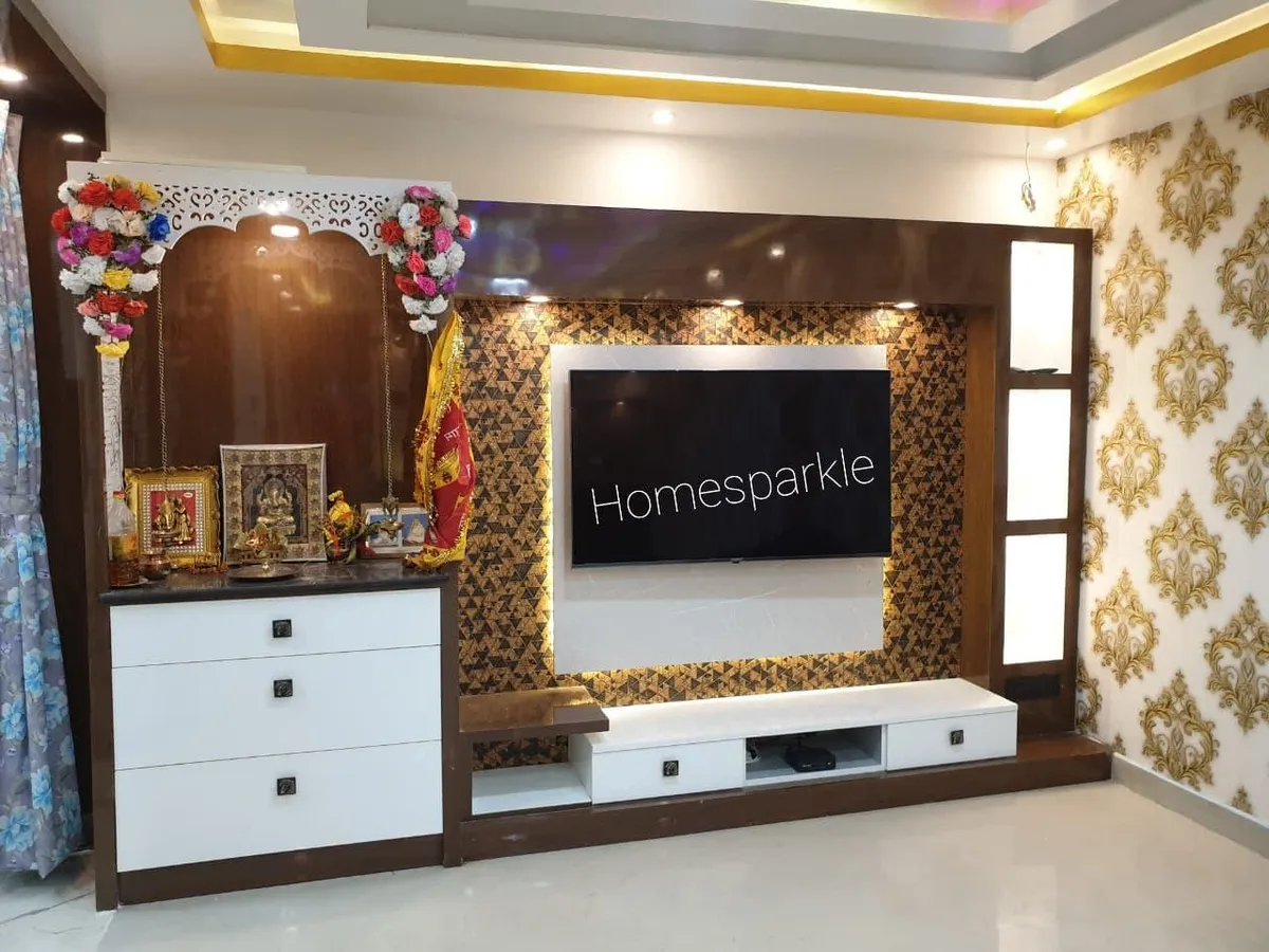 Living room TV feature wall with a gold triangle-mosaic accent panel, white console with drawers