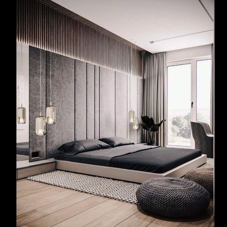 Render of a master bedroom with a channel-tufted grey fabric headboard wall, a wood-slat ceiling feature above the bed, a low platform bed with black linen