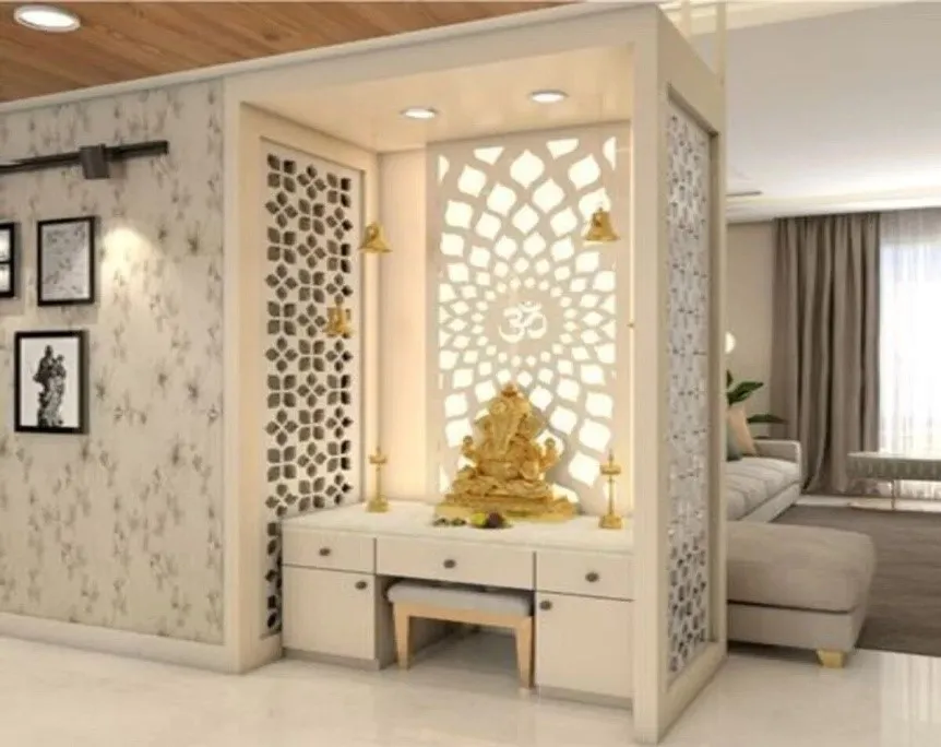 Render of a walk-in pooja niche framed as a freestanding box off the living room, with a backlit lotus-pattern jaali carrying a cut-out Om behind a brass