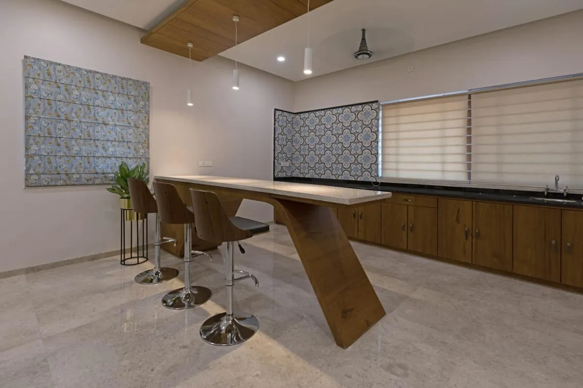 Bar-height breakfast counter on a single cantilevered teak leg with three swivel stools