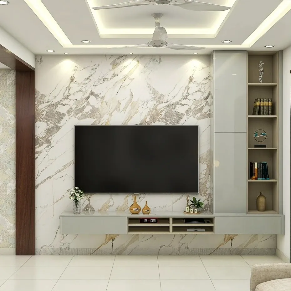 Render of a living-room TV wall clad in gold-veined white marble, with a sage-grey handleless console running under the screen into a tall unit of open oak