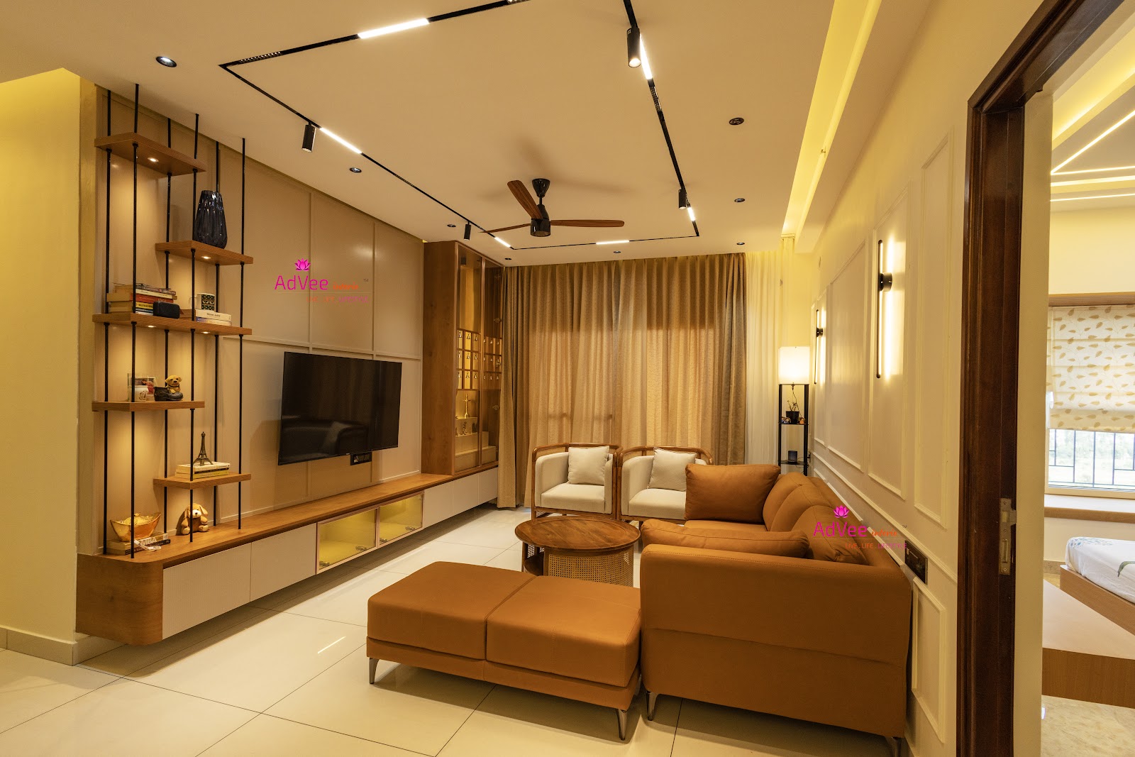 Living room with a floating wood-and-white TV console with backlit glass drawers, an open ladder-style display shelf