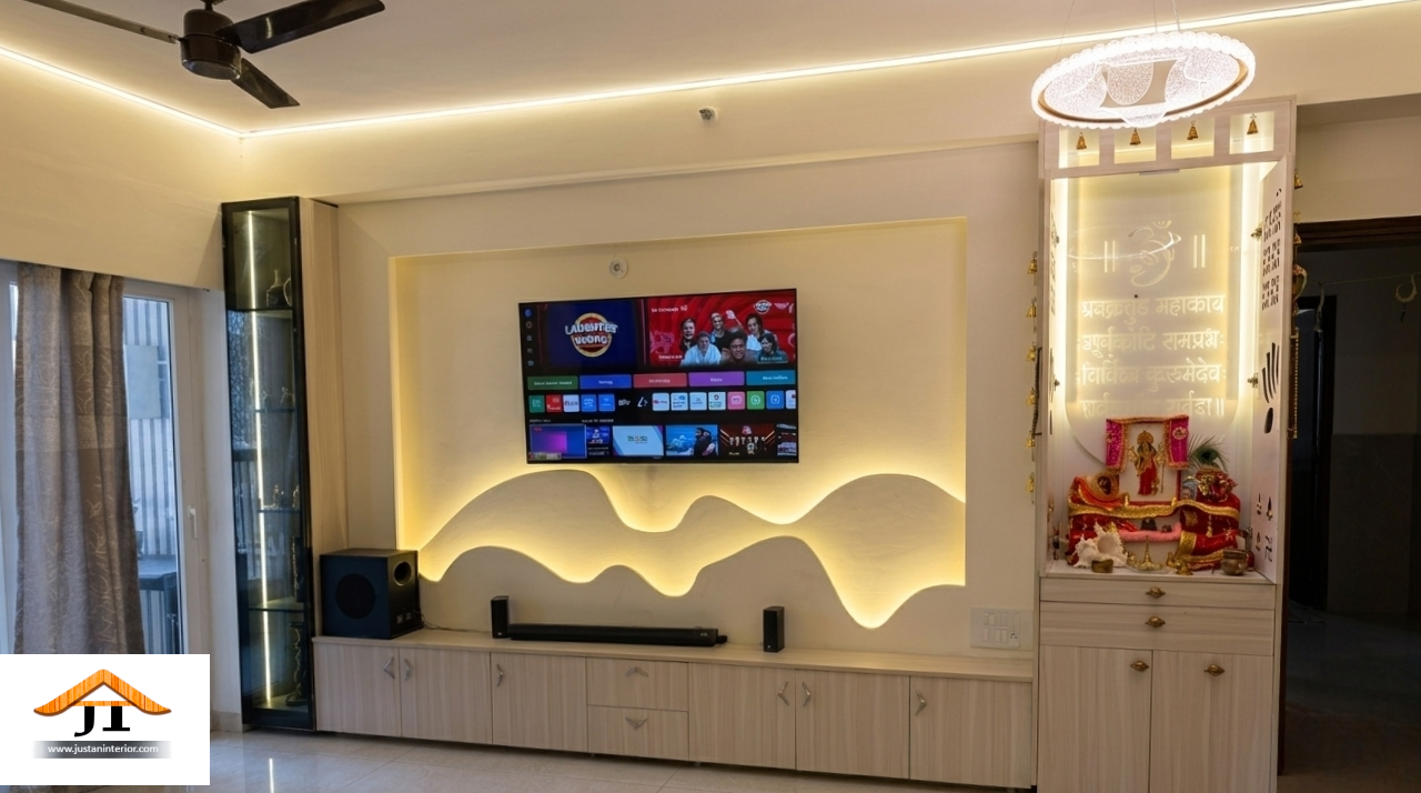 Living room TV wall with a sculpted wave-pattern backlit panel behind the television, a floating storage console with soundbar and subwoofer