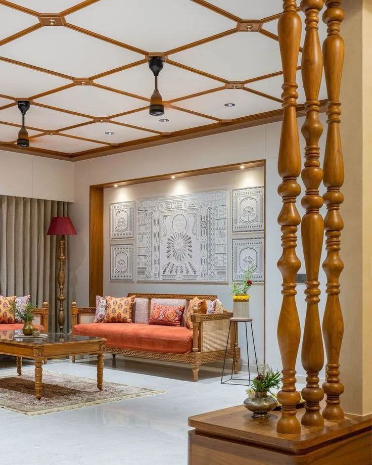 Traditional living room where a teak batten lattice with brass rosettes covers the whole ceiling, a row of lathe-turned teak columns screens the entry