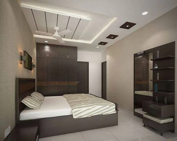 Render of a compact bedroom where a wenge wardrobe wall with a burl-laminate band runs behind a storage bed