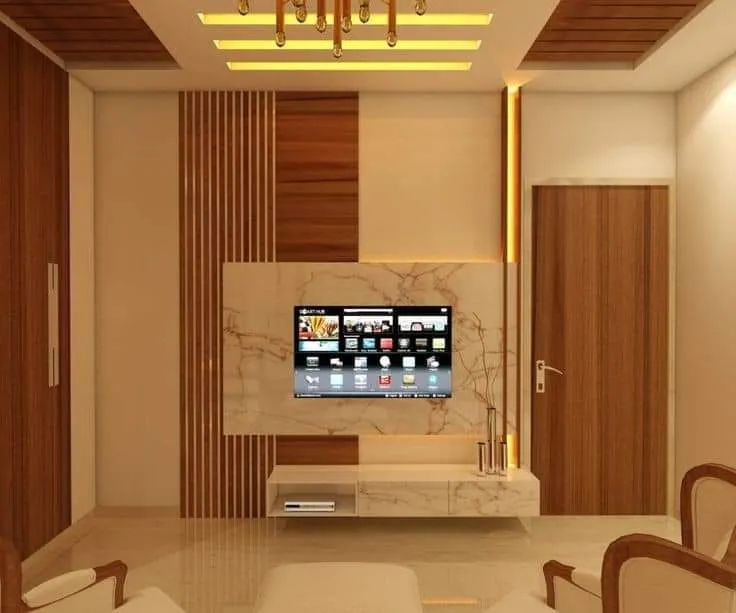 Render of a living room TV feature wall combining marble cladding and vertical wood fluting, lit by a cove-ceiling pendant chandelier.