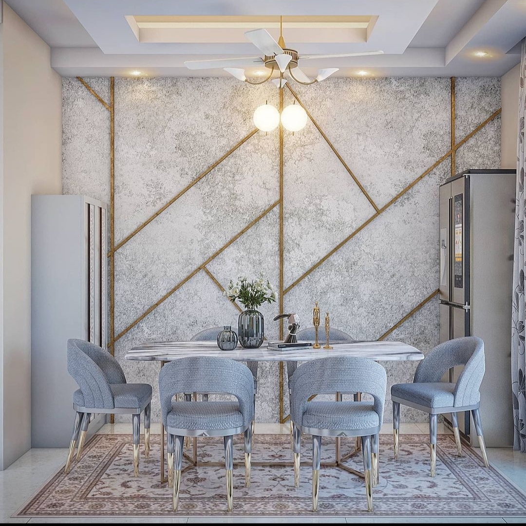 Rendered dining room with a grey marble-effect wall crossed by gold inlay lines, a marble-top table with grey velvet gold-legged chairs