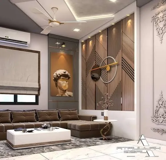 Small watermarked render of a living room with a brown tufted L-sofa and white block coffee table facing a wood-slat feature wall in mixed chevron and vertical