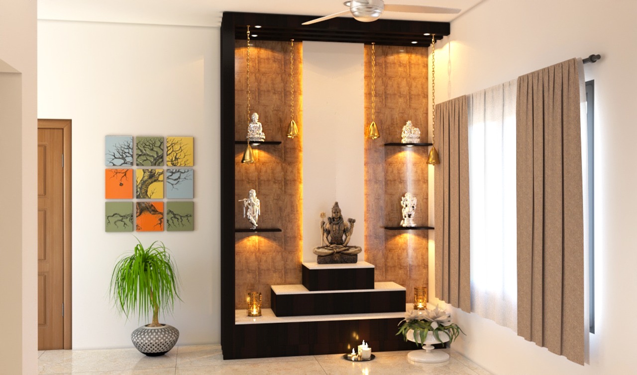 Render of a pooja alcove with a dark wood mandir unit, backlit textured wall panels flanking a deity statue on a tiered marble platform, hanging brass bells