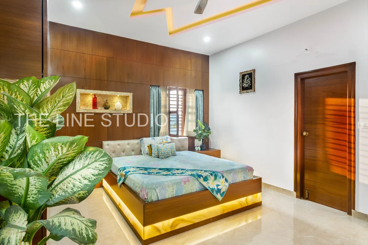 Bedroom with a full-height teak veneer headboard wall, a stone-lined lit display niche