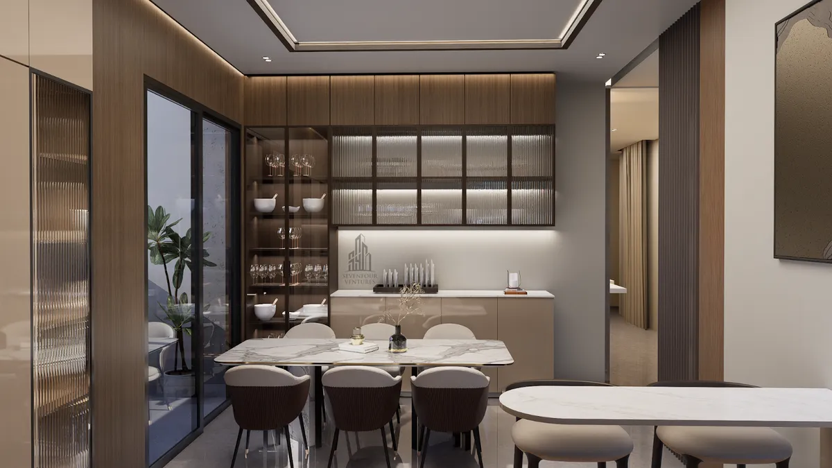 Render of a dining area with fluted wood panelling, a backlit glass-front crockery display and a marble-top dining table with dark upholstered chairs.