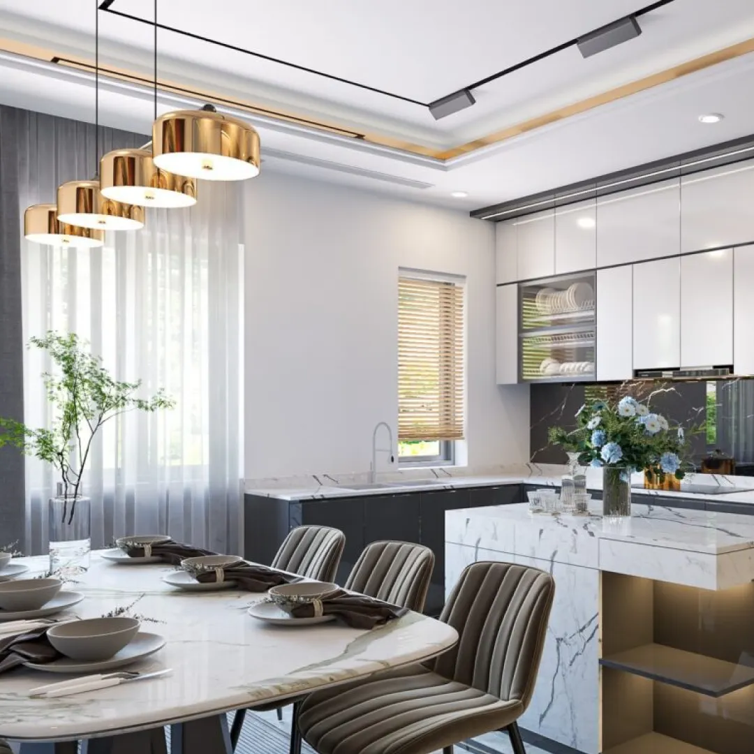 Render of an open dining zone: an oval marble table laid for six under a row of polished gold drum pendants