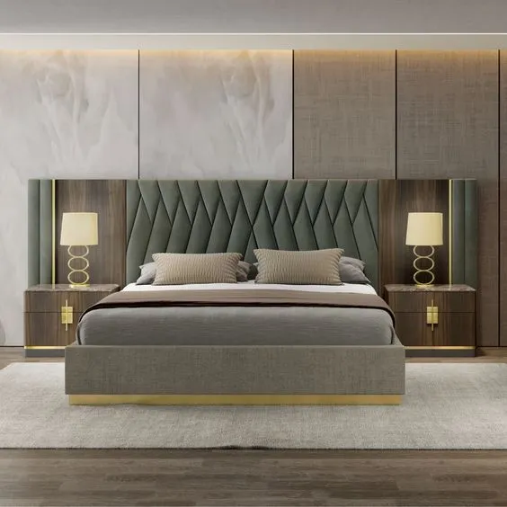 Render of a sage-green velvet bed wall where a diamond-quilted headboard runs out into channel-tufted side wings with brass reveals