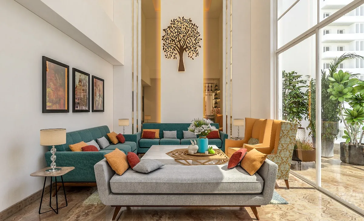 Double-height living room with two teal channel-tufted sofas and a grey daybed on tapered wood legs around a low stone table