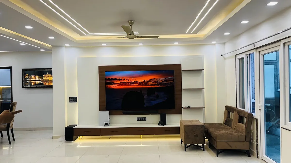Living room built around a white-and-walnut wall-hung TV unit on an LED underglow