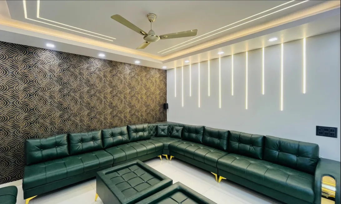 Living room with a swirl-patterned bronze-and-black wallpaper feature wall, vertical hanging LED light strips