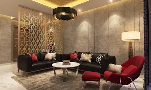 Render of a living room with a gold hexagonal jaali partition screen, a black drum pendant chandelier, a black leather sofa styled with red cushions