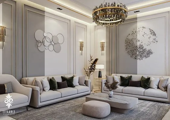 Rendered formal living room with raised gold-trimmed wall panel moulding, a tiered crystal-and-brass chandelier, twin beige sofas