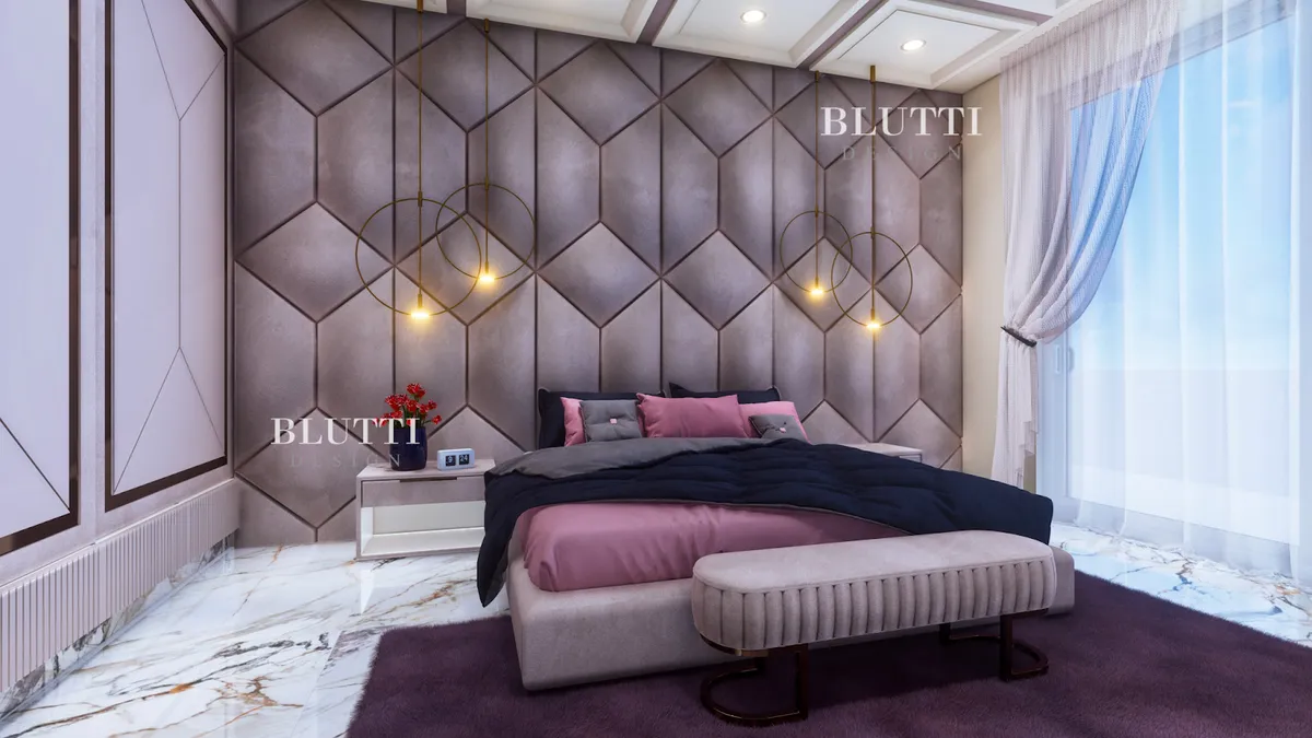 Render of a bedroom with a taupe suede hexagon-panelled headboard wall, brass ring pendants hung at each bedside