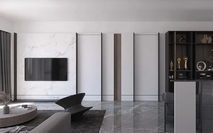 Render of a monochrome living room with a marble panel TV wall framed in black metal strips, a sculptural black lounge chair, a round stone coffee table