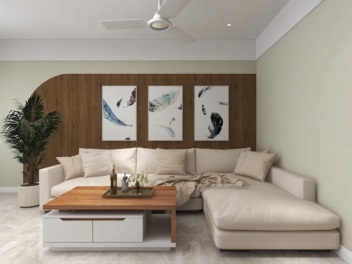 Render of a living room with a beige L-shaped sectional against an arched wood-panelled wall, a three-piece feather-print gallery wall