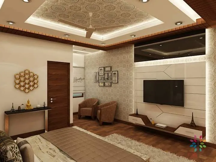 Render of a bedroom shot from the bed's foot, showing a cream TV wall cut into angular faceted panels with a stepped wooden console below