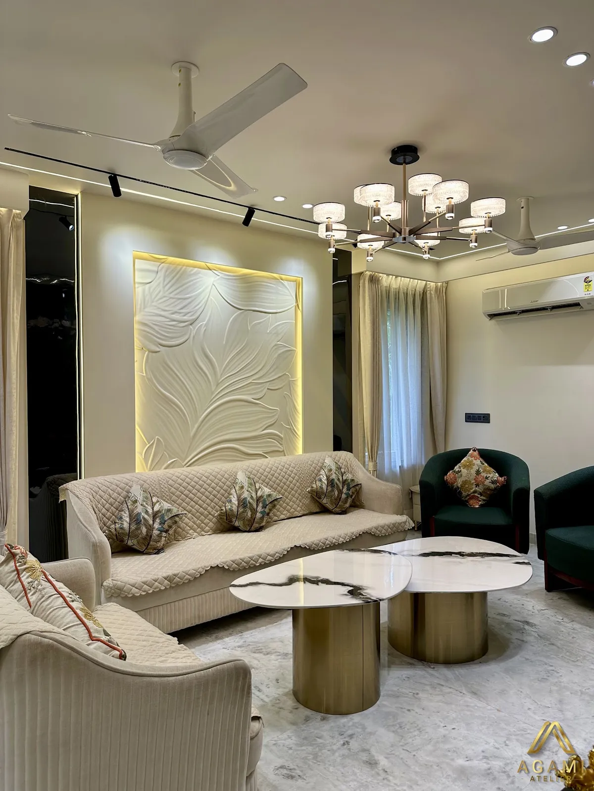 Cream living room with a backlit carved leaf-relief panel behind a quilted-cover sofa