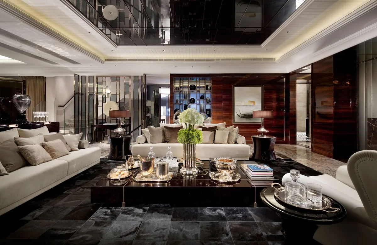 Double-height luxury living room with a glossy black mirrored ceiling, dark wood panelled walls