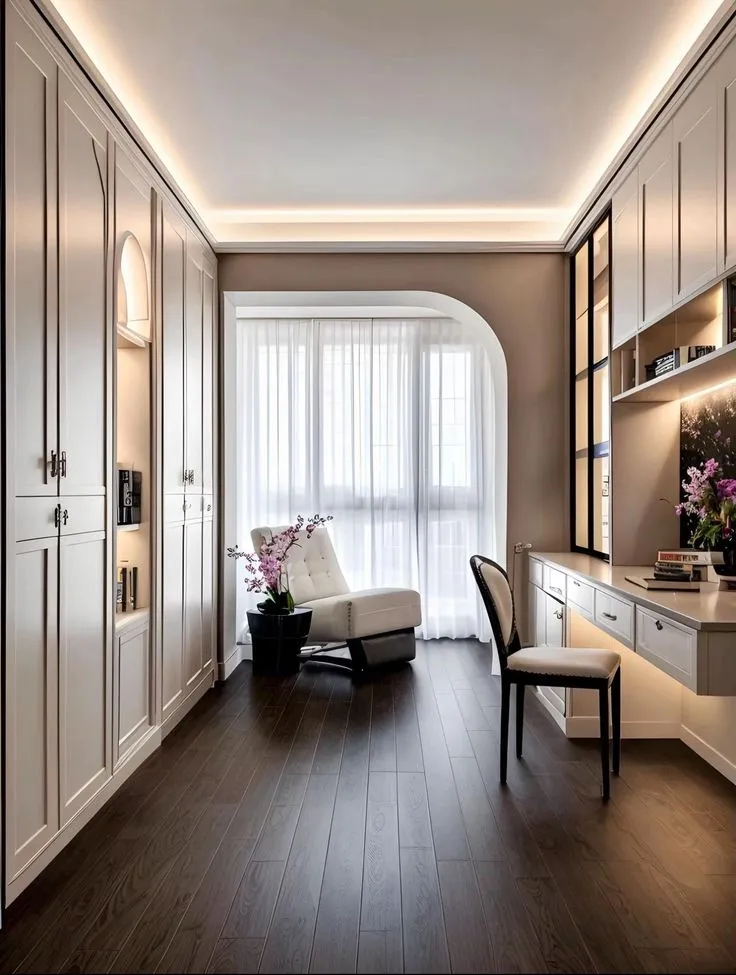 Render of a narrow study-cum-dressing run: floor-to-ceiling ivory shaker wardrobes on one side, a built-in desk with overhead cabinets on the other