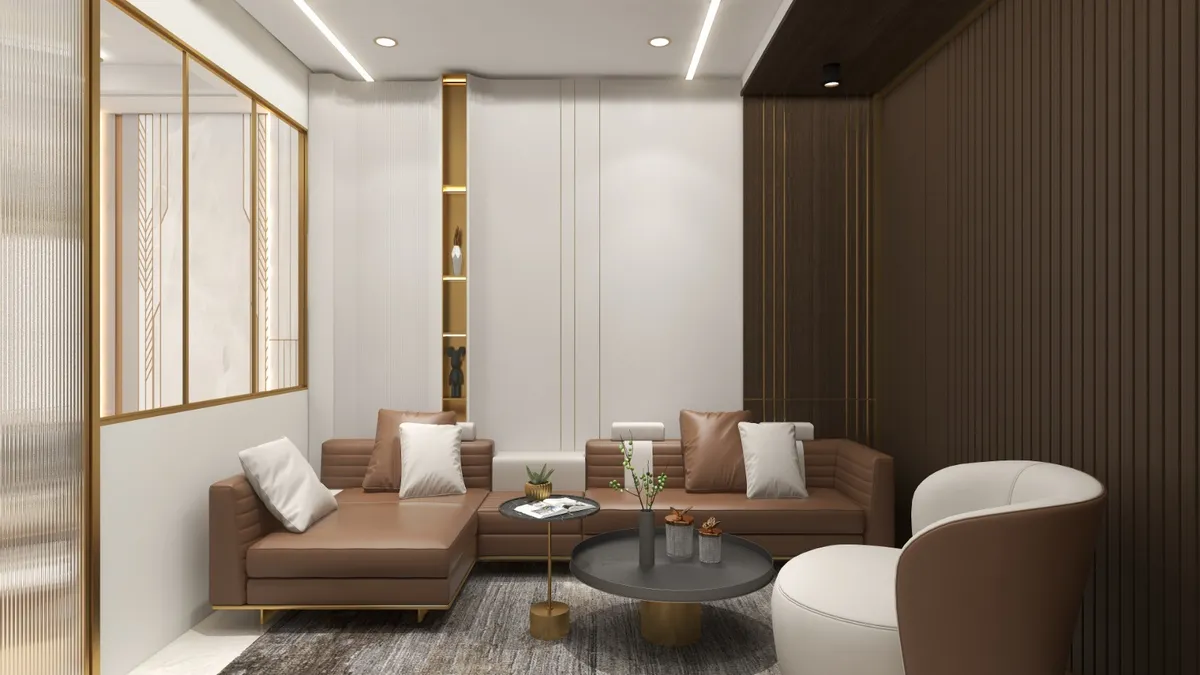 Render of a living room with a tan leather sectional sofa and white armchair against a dark fluted wood panel wall with a backlit gold-trimmed display niche.