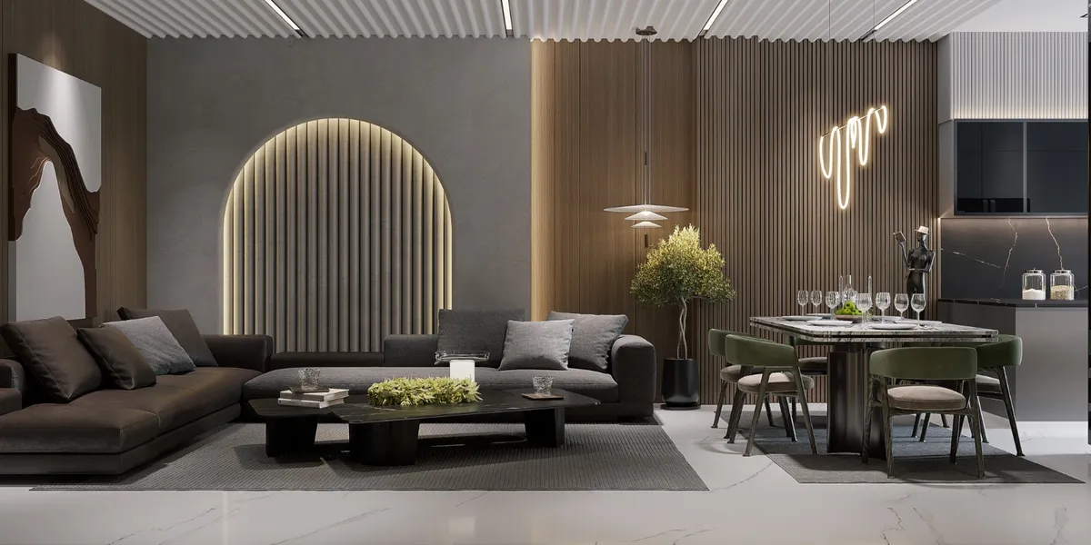 Render of an open living-dining-kitchen in browns and greys: a deep brown modular sofa faces a backlit fluted arch niche in a grey plaster wall