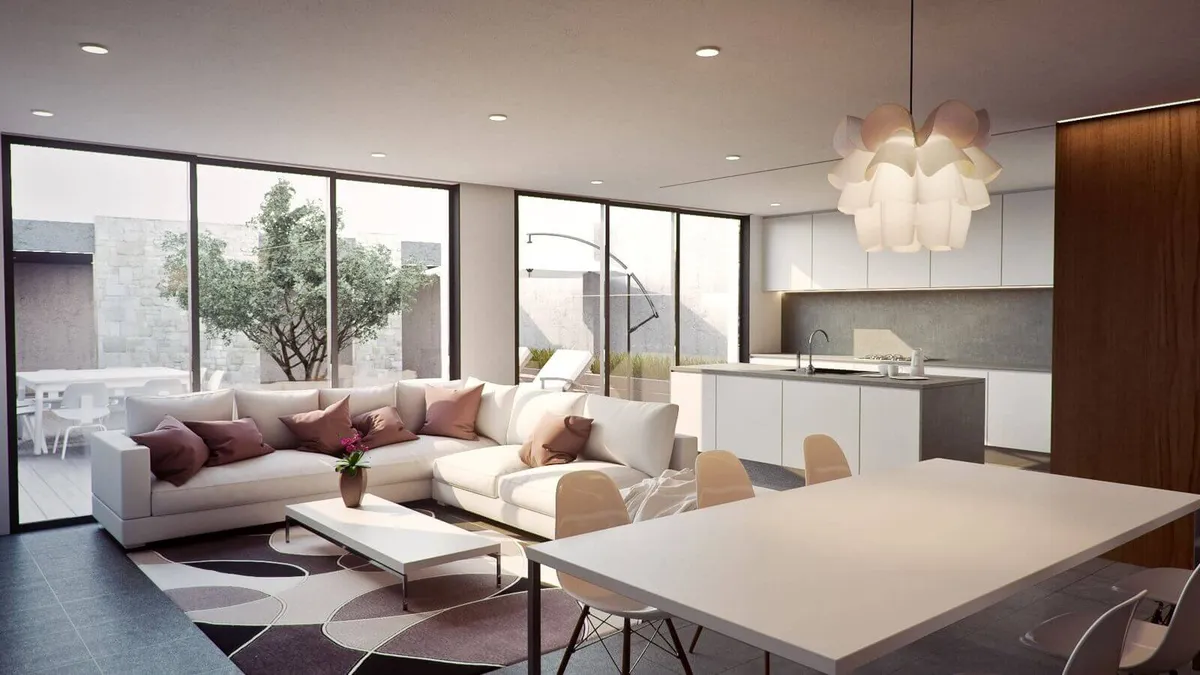 Render of an open-plan floor where a white L-sofa with dusty-rose cushions, a long white dining table and a handleless island kitchen share one room