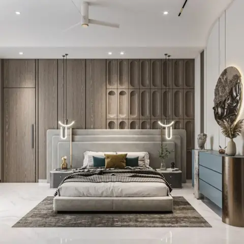 King bed against a fluted wood panelling wall with carved oval niches, flanked by ring-shaped pendant lights and a