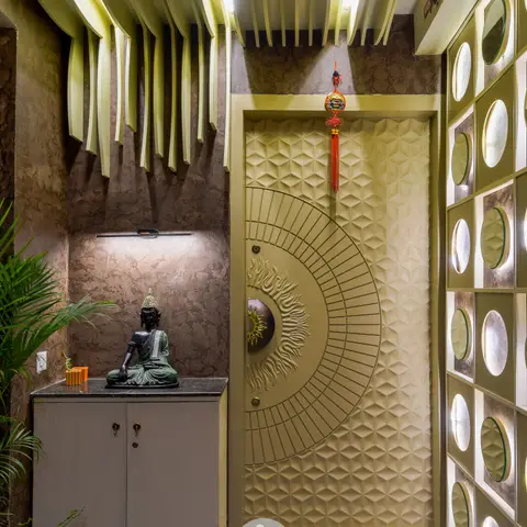 Dramatic entrance foyer with a sculptural sunburst-patterned gold main door, a ribbon-fin ceiling feature, and a wall of