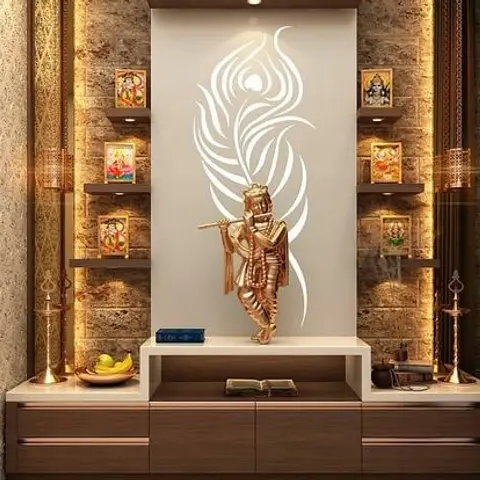 A pooja unit with a backlit Krishna silhouette panel, stone-textured side walls holding brass diyas and framed deity images,