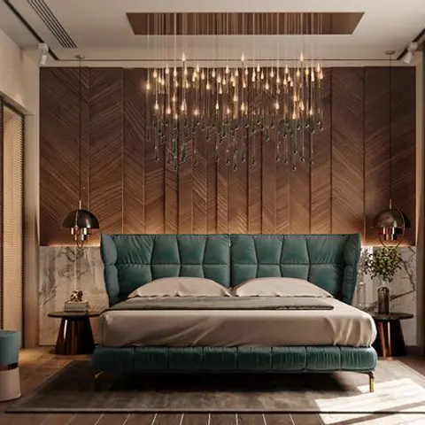 Bedroom with a teal velvet channel-tufted bed against a chevron wood panelled wall, under a cascading multi-drop pendant