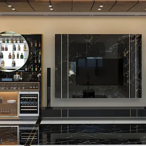 Living room feature wall with a book-matched black-marble TV panel and gold trim beside a mirrored home bar unit with a wine