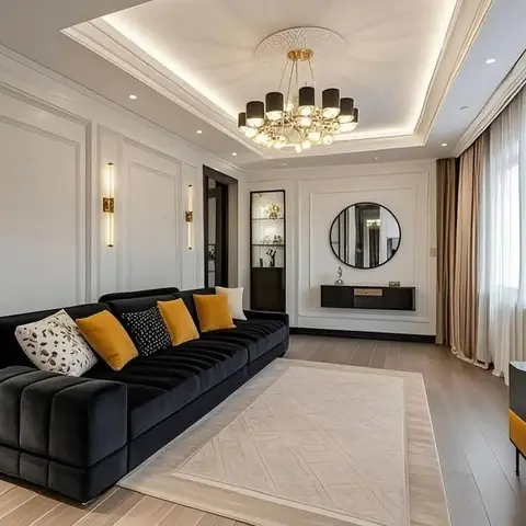 A black channel-tufted velvet sofa with mustard cushions sits under a tiered POP ceiling and an ornate drum chandelier,