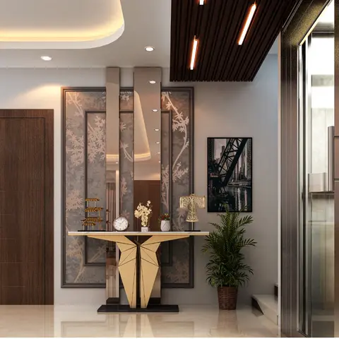 a private residence entrance foyer with a sculptural gold-based console table below a mirrored floral-panel wall, a