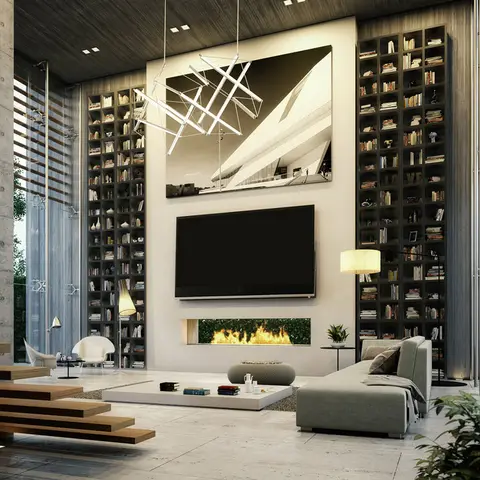 Double-height living room with a floating timber staircase and floor-to-ceiling bookshelves flanking a TV and built-in